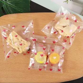100 шт. Мешок для конфет Пищевая компания в форме сердца Пластиковый самостоятельный пакет для упаковки печенья для пекарни